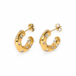 Gold plated half hoop earrings with embedded CZ on a white background
