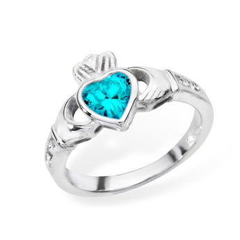 Shop this December birthstone blue topaz Claddagh ring in silver. Stunning jewellery symbolizing love, loyalty & friendship. Perfect gift from Urban Pizazz UK.