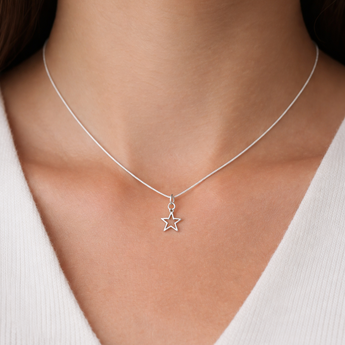 Urban Pizazz Model Wearing 925 Sterling Silver Star Pendant Necklace on FIne Silver Curb Chain