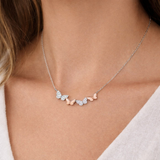 Urban Pizazz Model Wearing 925 Sterling Silver Butterfly Bar Necklace With Two-Tone Rose Gold Plated Details and Clear Cubic Zirconia Stones