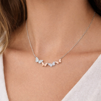 Urban Pizazz Model Wearing 925 Sterling Silver Butterfly Bar Necklace With Two-Tone Rose Gold Plated Details and Clear Cubic Zirconia Stones