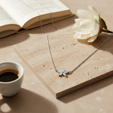 Sterling Silver & Cubic Zirconia Flower Necklace flat lay display