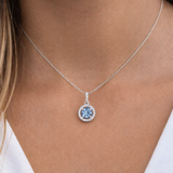 Sterling Silver Cubic Zirconia Halo Pendant Necklace with a blue topaz centre stone on Model