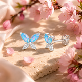 Sterling Silver, Cubic Zirconia & Opal Butterfly Stud Earrings with blossom background