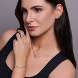 Urban Pizazz Model Wearing 925 Sterling Silver Stud Jewellery Set in a classic Toi et Moi Design, featuring Pink and Clear Cubic Zirconia Stones