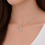 Urban Pizazz Model Wearing 925 Sterling Silver and Rose Gold Two-Tone Love Heart Pendant Necklace with Cubic Zirconia Detail on Silver Curb Chain