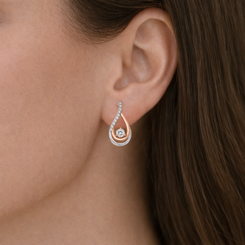 Urban Pizazz Model Wearing925 Sterling Silver and Rose Gold Teardrop Statement Stud Earrings with Cubic Zirconia Details
