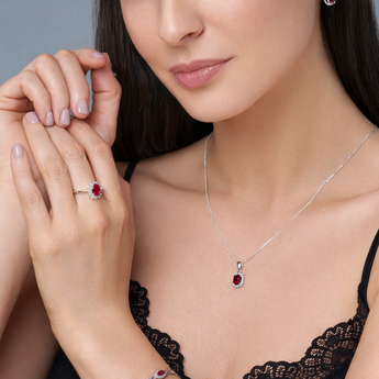 Urban Pizazz Model Wearing 925 Sterling Silver and Ruby CZ Jewellery - Ring, Necklace, Earrings, Bracelet