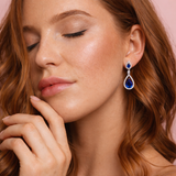 Urban Pizazz Model Wearing 925 Sterling Silver Luxury Sapphire CZ Teardrop Stud Earrings
