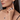 Urban Pizazz Model Wearing Matching Sterling Silver Sapphire CZ Jewellery, Including 2 Rings, a Necklace and Matching Earrings