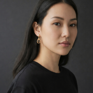 Urban Pizazz Model wearing 9ct Gold Diamond Cut Drop Earrings