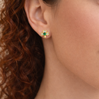 Urban Pizazz Model wearing 9ct Gold Emerald Green Cubic Zirconia Shamrock Stud Earrings