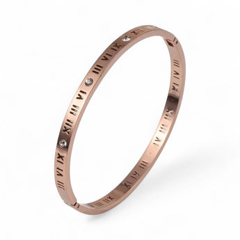 Rose gold plated bracelet with Roman numeral design on a white background