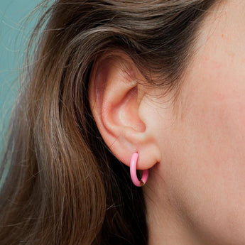 Amnesia Jewellery | Hot Pink Enamel Abi Hoop Earrings. Our Abi Hinged Hoop Earrings are made from gold plated stainless steel with a vibrant pink coloured enamel. Tarnish Free and Waterproof. Shop now for quality Jewellery/Jewelry!