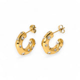 Gold plated half hoop earrings with embedded CZ on a white background