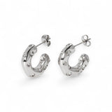 Stainless steel half hoop earrings with CZ stones on a white background