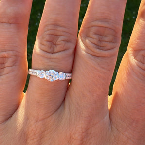 The Aurelia Promise Ring features three sparkling CZ stones on a 925 sterling silver band with pavé accents. Perfect as a promise, engagement or occasion ring.