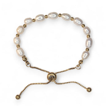 Embrace timeless coastal elegance with our Beach Pearl Bolo Bracelet. Featuring freshwater pearls delicately spaced with polished gold-toned beads, the adjustable bolo clasp ensures a comfortable fit for any wrist. Shop now for quality Jewellery/Jewelry!