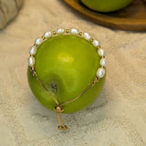 Embrace timeless coastal elegance with our Beach Pearl Bolo Bracelet. Featuring freshwater pearls delicately spaced with polished gold-toned beads, the adjustable bolo clasp ensures a comfortable fit for any wrist. Shop now for quality Jewellery/Jewelry!