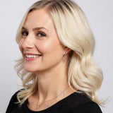 Model wearing Sterling Silver Cubic Zirconia Star Shaped Hoop Earrings