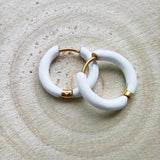 Amnesia Jewellery | White Enamel Chelsea Hoop Earrings. Our Chelsea Hinged Hoop Earrings are made from gold plated stainless steel with a bright white coloured enamel. Tarnish Free and Waterproof. Shop now for quality Jewellery/Jewelry!