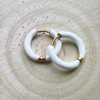 Amnesia Jewellery | White Enamel Chelsea Hoop Earrings. Our Chelsea Hinged Hoop Earrings are made from gold plated stainless steel with a bright white coloured enamel. Tarnish Free and Waterproof. Shop now for quality Jewellery/Jewelry!