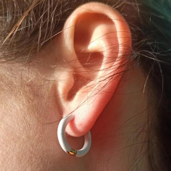 Amnesia Jewellery | White Enamel Chelsea Hoop Earrings. Our Chelsea Hinged Hoop Earrings are made from gold plated stainless steel with a bright white coloured enamel. Tarnish Free and Waterproof. Shop now for quality Jewellery/Jewelry!