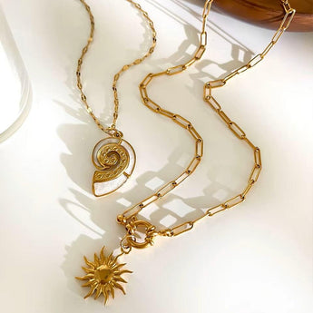 Amnesia Jewellery | Gold Plated Stainless Steel Conch and Sun stackable Necklace. Our elegant Conch and Sun Stacking Necklace Set, made from durable 18ct gold plated stainless steel and enamel. Tarnish Free and Waterproof. Shop now for quality Jewellery/Jewelry!