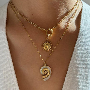 Amnesia Jewellery | Gold Plated Stainless Steel Conch and Sun stackable Necklace. Our elegant Conch and Sun Stacking Necklace Set, made from durable 18ct gold plated stainless steel and enamel. Tarnish Free and Waterproof. Shop now for quality Jewellery/Jewelry!