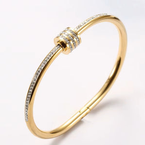 Amnesia Jewellery | Gold Plated /Stainless Steel / Rose gold Crystal Bangle. Our Crystal Wrap Bangle, crafted from stainless steel and elegantly wrapped in a choice of rose gold, yellow gold, or classic stainless steel. Tarnish Free and waterproof. Shop now for quality Jewellery/Jewelry!