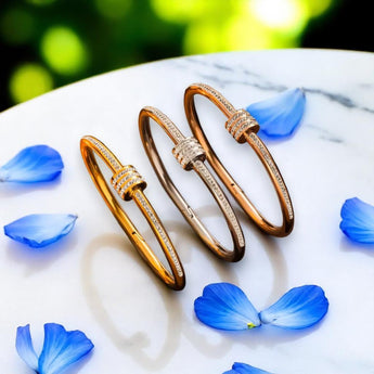 Amnesia Jewellery | Gold Plated /Stainless Steel / Rose gold Crystal Bangle. Our Crystal Wrap Bangle, crafted from stainless steel and elegantly wrapped in a choice of rose gold, yellow gold, or classic stainless steel. Tarnish Free and waterproof. Shop now for quality Jewellery/Jewelry!