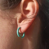 Amnesia Jewellery | Turquoise Enamel Demi Hoop Earrings. Our Demi Hinged Hoop Earrings are made from gold plated stainless steel with a vibrant turquoise blue coloured enamel. Tarnish Free and Waterproof. Shop now for quality Jewellery/Jewelry!