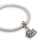 Sterling silver goldfish dangle charm featuring blue opal & CZ accents. Hypoallergenic, gift-ready and compatible with European style charm bracelets.
