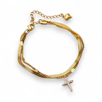 Our adorable Herringbone Cross Anklet! This sweet treasure features a cubic zirconia cross alongside a gold-plated herringbone chain. Tarnish Free and Waterproof