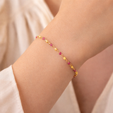 Urban Pizazz Model Wearing Our Gold Plated Sterling Silver Delilah Beaded Bracelet Featuring Pink and Yellow Enamel Details