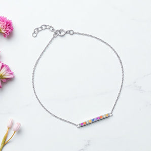 Rainbow Bar Bracelet – 925 Sterling Silver & CZ Stone by Urban Pizazz. Shop our 925 sterling silver Rainbow Bar Bracelet with vibrant CZ stones. Dainty, adjustable, hypoallergenic – perfect for layering or gifting in the UK.
