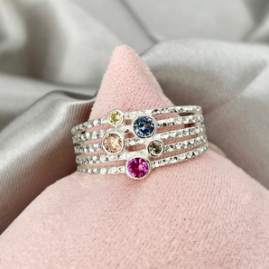 Rainbow Dots Statement Ring – 925 Sterling Silver by Urban Pizazz. Turn heads with our Rainbow Dots Statement Ring in 925 silver. Featuring vibrant CZ stones, this bold piece is hypoallergenic and full of personality.