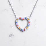 Rainbow Heart Necklace – 925 Silver & CZ Gemstones by Urban Pizazz. Shop the Rainbow Heart Necklace in 925 sterling silver with colourful CZ stones. Dainty, hypoallergenic and perfect for gifting or everyday wear.