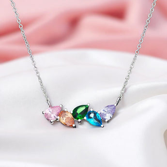 Rainbow Pear Drop Necklace – 925 Silver & CZ Stones by Urban Pizazz. Shop the Rainbow Pear Drop Necklace in 925 silver with pear-cut rainbow cubic zirconia accents. Dainty, hypoallergenic, and perfect for layering or gifting.
