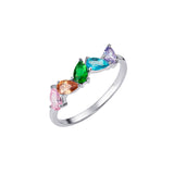 Rainbow Pear Drop Ring – 925 Sterling Silver & CZ by Urban Pizazz. Shop the Rainbow Pear Drop Ring in 925 silver. Featuring a pear-cut CZ stones in rainbow accents, it’s dainty, hypoallergenic, and perfect for everyday sparkle.