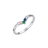 Rainbow Wishbone Ring – 925 Sterling Silver & CZ by Urban Pizazz. Shop our 925 silver Rainbow Wishbone Ring with vibrant CZ stones. A dainty V-shaped band symbolising luck, love & pride. Stackable and hypoallergenic.