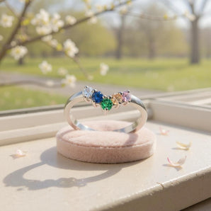 Rainbow Wishbone Ring – 925 Sterling Silver & CZ by Urban Pizazz. Shop our 925 silver Rainbow Wishbone Ring with vibrant CZ stones. A dainty V-shaped band symbolising luck, love & pride. Stackable and hypoallergenic.