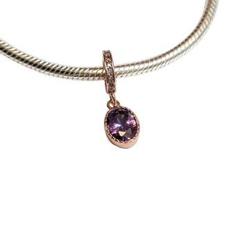 Sterling silver charm with rose gold plating and an oval amethyst cubic zirconia. Hypoallergenic, elegant and perfect jewellery idea for charm bracelets.