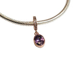 Sterling silver charm with rose gold plating and an oval amethyst cubic zirconia. Hypoallergenic, elegant and perfect jewellery idea for charm bracelets.