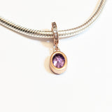 Sterling silver charm with rose gold plating and an oval amethyst cubic zirconia. Hypoallergenic, elegant and perfect jewellery idea for charm bracelets.