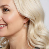 Model wearing Sterling Silver Cubic Zirconia Star Shaped Hoop Earrings