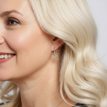 Model wearing Sterling Silver Cubic Zirconia Star Shaped Hoop Earrings