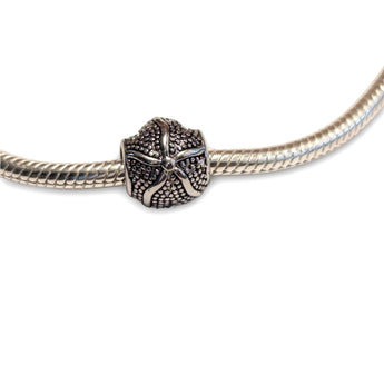 Sterling silver starfish bead charm - perfect for charm bracelets or necklaces. Hypoallergenic, beautifully detailed and gift-ready with coastal charm.