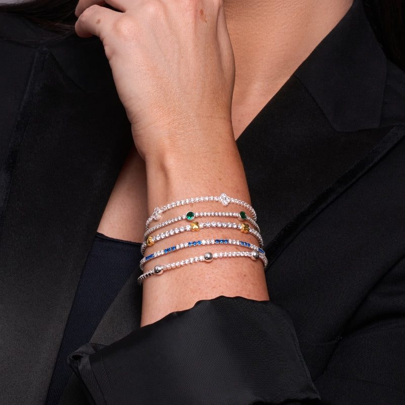 Urban Pizazz Model Wearing a stack of 925 Sterling Silver & Cubic Zirconia Bracelets, with some gold plated details