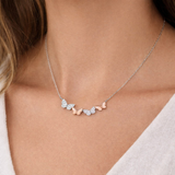 Urban Pizazz Model Wearing Sterling Silver Butterfly bar necklace with cubic zirconia stones